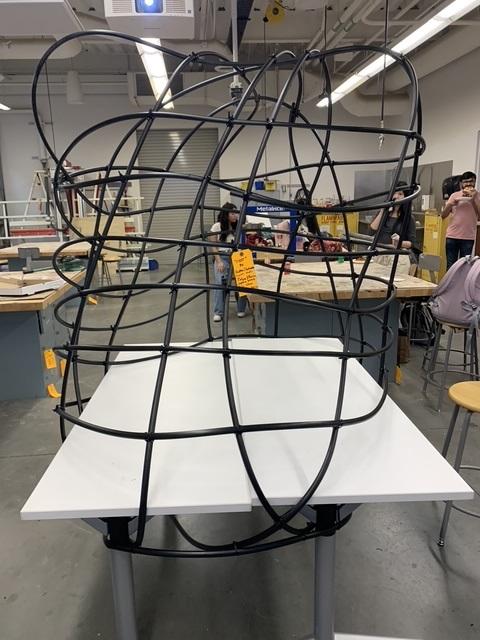 Art object of tubes on table