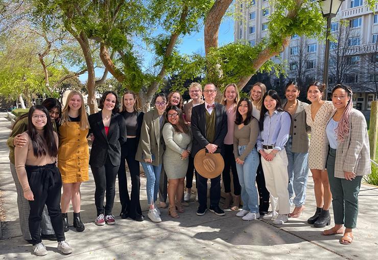 Daniel Press with senior Child Studies students at the Child Studies Poster Session where students presented their senior capstone projects, March 9, 2022.