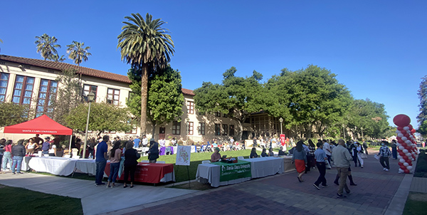 Tables set up with people walking around