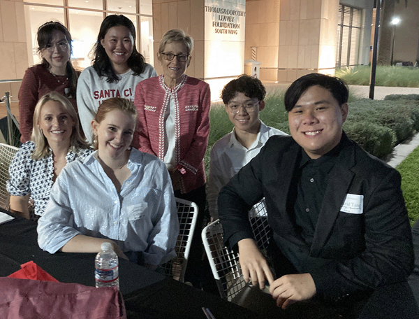 Six CAS student ambassadors with SCU President Julie Sullivan