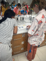 Tech Trek students performing an experiment to test for vitamin C in various beverages, SCDI labs, Santa Clara University