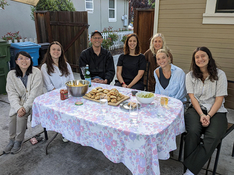 Faculty and students at table