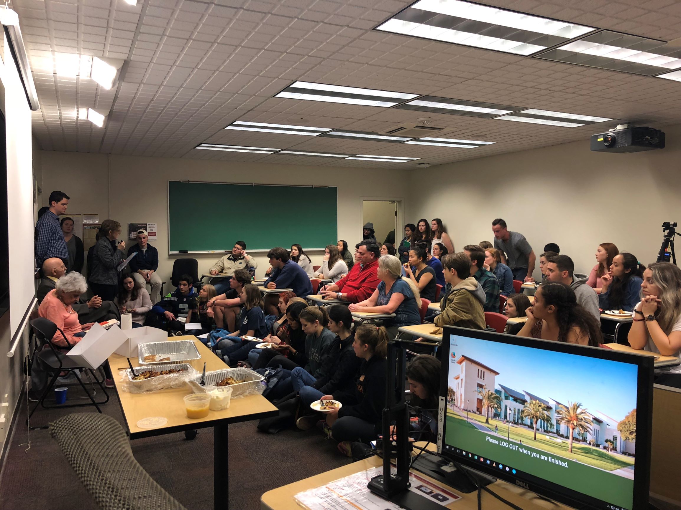 Students attend a discussion with Holocaust survivors