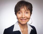 A woman smiling in a professional headshot.