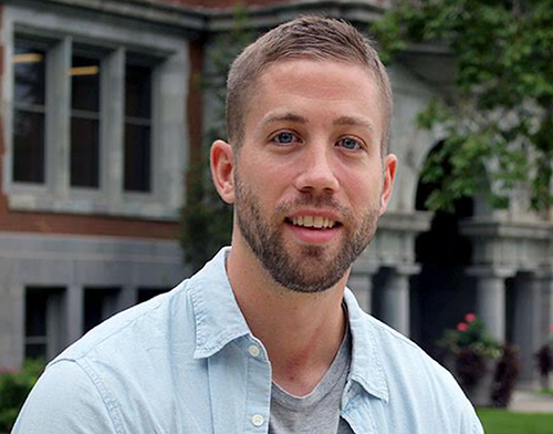 A person in front of a building labeled 'Tripp Strawbridge.'