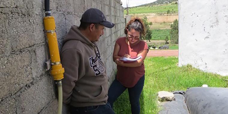 Julieta is interviewing a customer on his farm in Tlaxcala