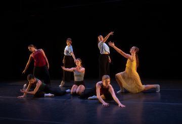 5 female modern dancers kneeling