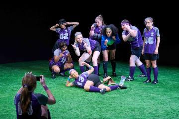 College womens soccer team posing for group photo