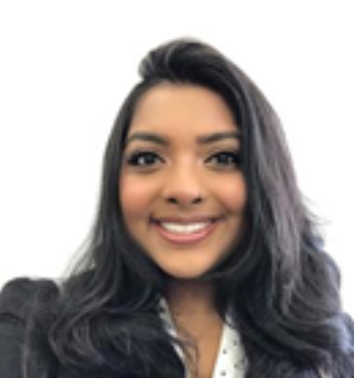 Smiling person with long hair wearing a dark jacket against a white background.