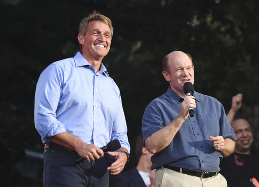 Sen. Jeff Flake, R-Ariz., left, and Sen. Chris Coons, D-Del. (AP Images/Evan Agostini)