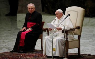 Pope Francis, right, delivers his message during his weekly general audience in the Paul VI hall at the Vatican, Wednesday, Oct. 21, 2020. Pope Francis endorsed same-sex civil unions for the first time as pope while being interviewed for the feature-length documentary “Francesco,” which premiered Wednesday at the Rome Film Festival. (AP Photo/Gregorio Borgia) image link to story