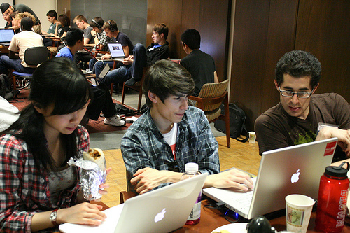 Students collaborating on laptops at a software engineering ethics workshop. image link to story