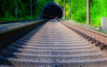 Train rails leading to tunnel