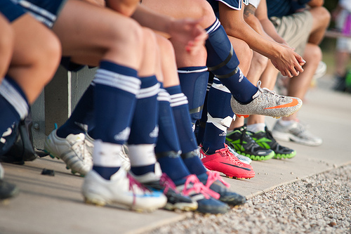 the legs of soccer players