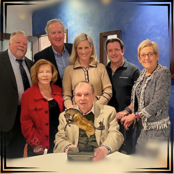 SCU President Julie Sullivan presents the Marty Melone Family with Founders Society Award in December, 2024. Pictured in photo: (seated) Marty Melone ’63; (standing l. to r.) Markkula Center for Applied Ethics Executive Director Don Heider, Donna Melone, Ethics Center Senior Director of Development Jim Kambe ’84, Markkula Center Advisory Board Member Denise Melone ’06, David Melone ’95, and Santa