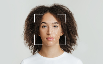 Biometric Facial Recognition of Expressionless Young African American Female. Photo by Prostock Studio via Canva for Education. 