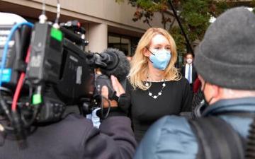 Elizabeth Holmes speaks with reporters. AP Photo/Tony Avelar