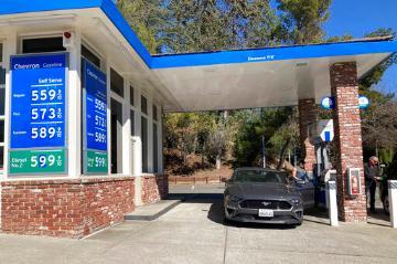 A motorist pumps gasoline at a gas station in Lafayette, Calif., Sunday, March 6 ,2022. image link to story