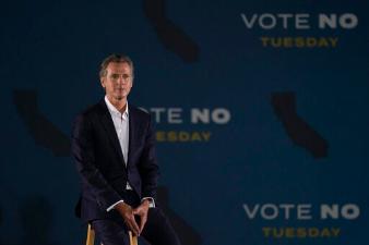 Gavin Newsom addressing supporters as a recall rally. image link to story