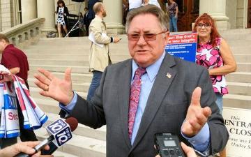 Shelby Township Clerk Stan Grot speaks with reporters after announcing his 2018 Republican run for Michigan secretary of state on Tuesday, Aug. 22, 2017, in front of the Capitol in Lansing, Mich. AP Photo/David Eggert image link to story