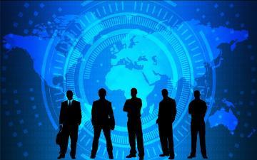 silhouette of five business people with world map image in the background