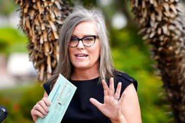 Arizona Democratic candidate for Governor Katie Hobbs speaks to the media before dropping off her primary election ballot Tuesday, July 21, 2022, in Scottsdale, Ariz. Ross D. Franklin via AP Photo