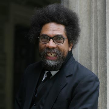 Alt text: Cornel West smiling while wearing a black suit.