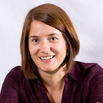 A person smiling with a white background.