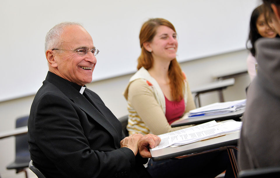 Fr. Reites in a classroom setting with students.