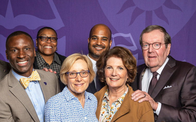 Julie Sullivan (front, center) with the Dougherty Family College team, including Dean Buffy Smith (back, left) and Michael Dougherty (far right).