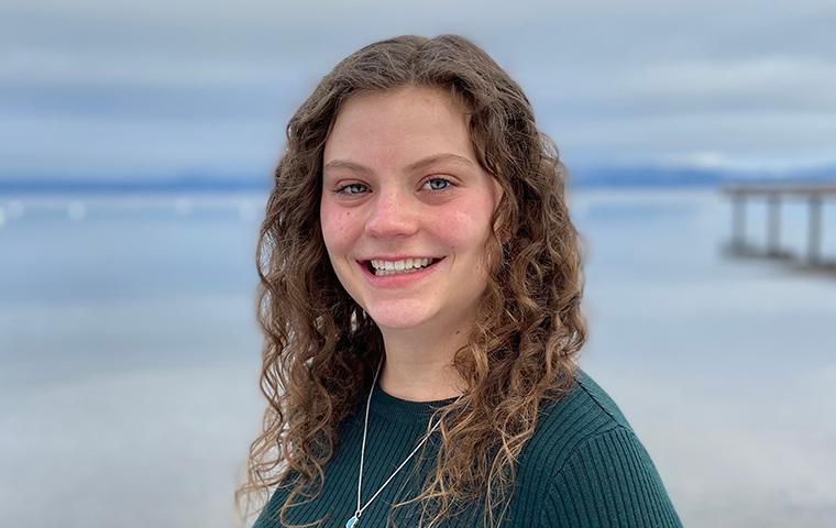 Alissa LaFerriere standing in front of the ocean