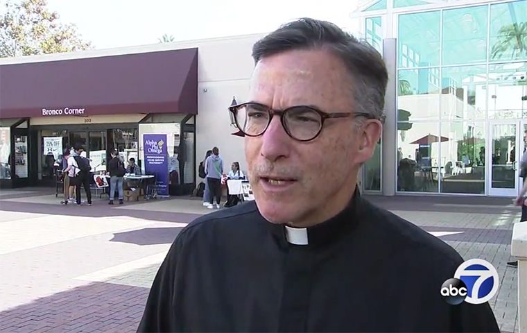 Kevin O'Brien being interviewed in front of the student bookstore