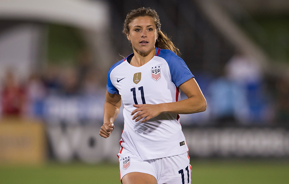 Sofia Huerta runs alone on a soccer field in a USWNT jersey