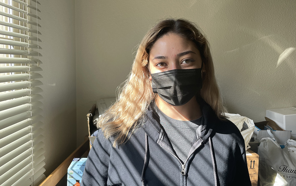 Sandra Del Toro stands in her dorm room