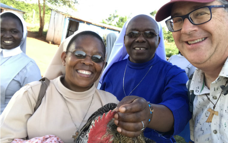 Keith Warner with two East African sisters in habits