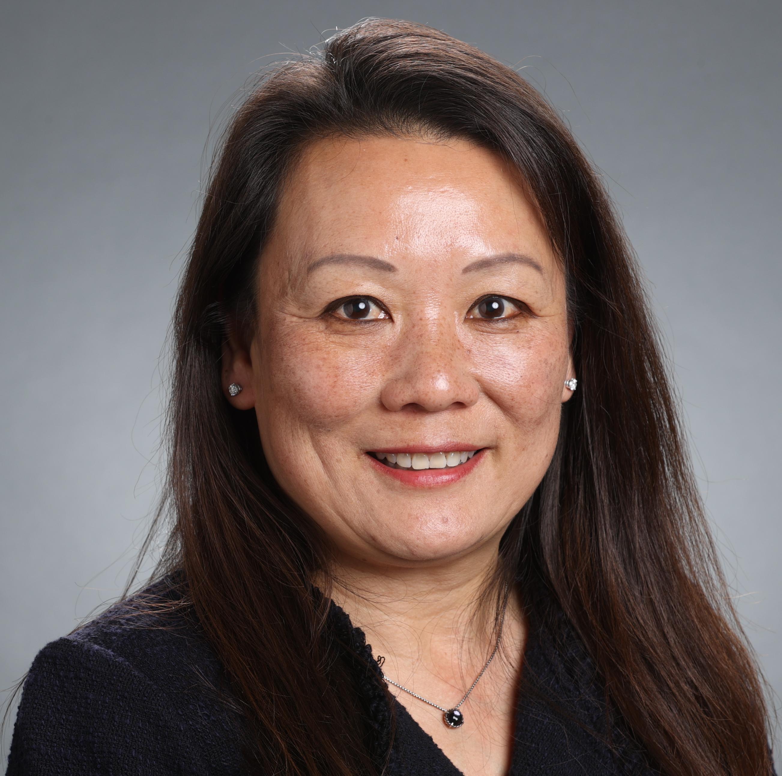 A person named Gloria Turner smiling in a professional portrait.