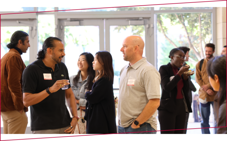 Business professionals networking in Lucas Hall, home to the Leavey School of Business