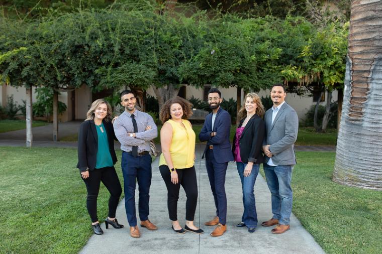 Group shot with Graduate Business Students standing outdoors - Graduate Students and Admissions Representatives Link to file