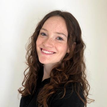 A person smiling in a headshot photo.