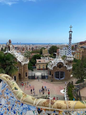 A wide view of a sunny urban landscape with various buildings.