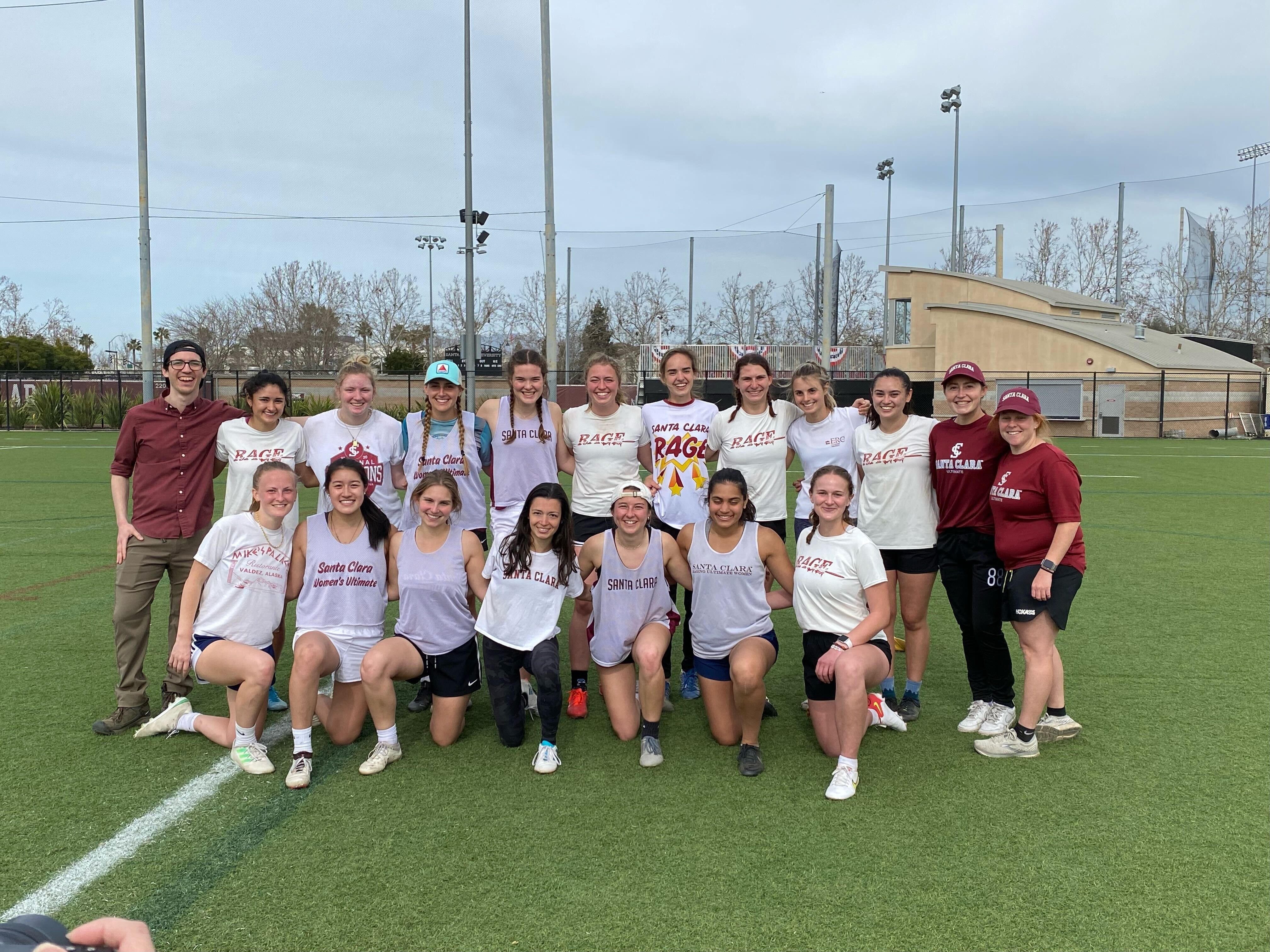 SCU RAGE lacrosse team posing on a field.
