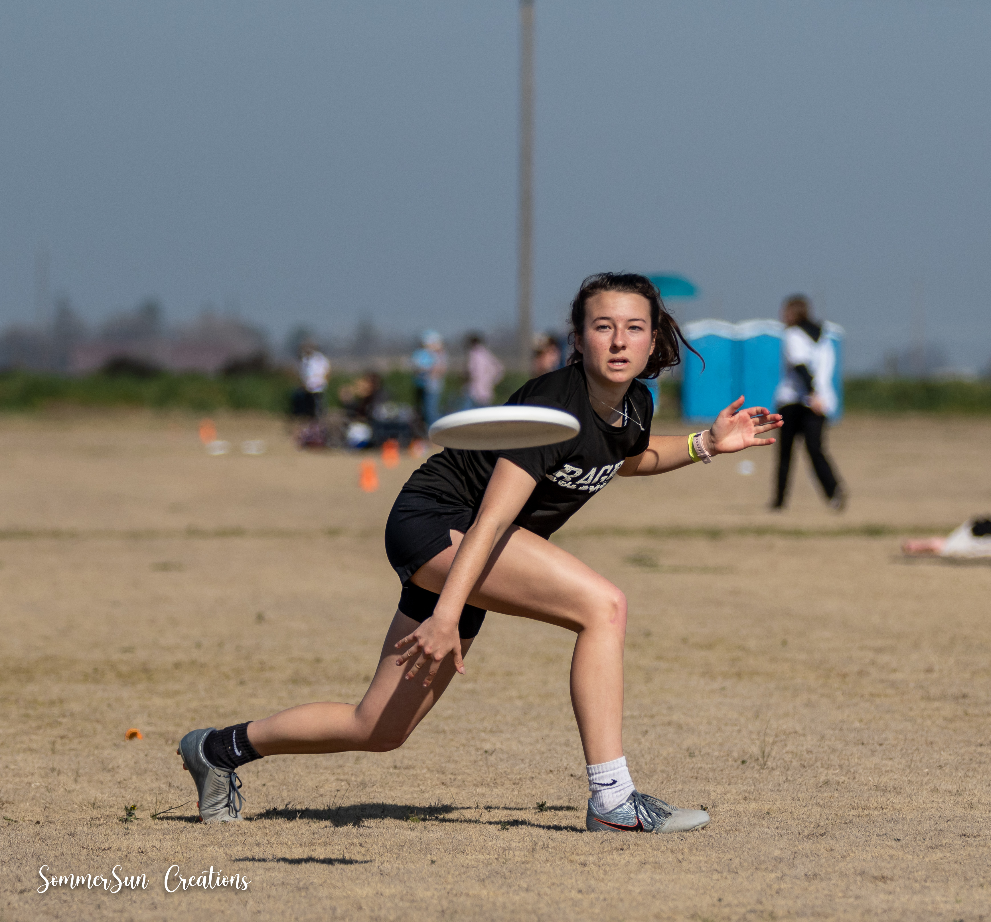 Person playing ultimate frisbee at the Stanford Open Tournament, February 2022.