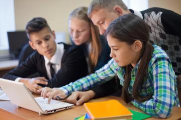 Students working together at the computer