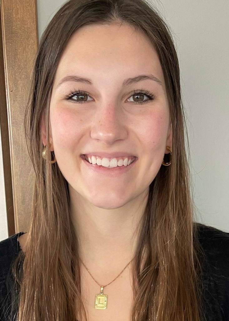 A woman smiling in a professional headshot.