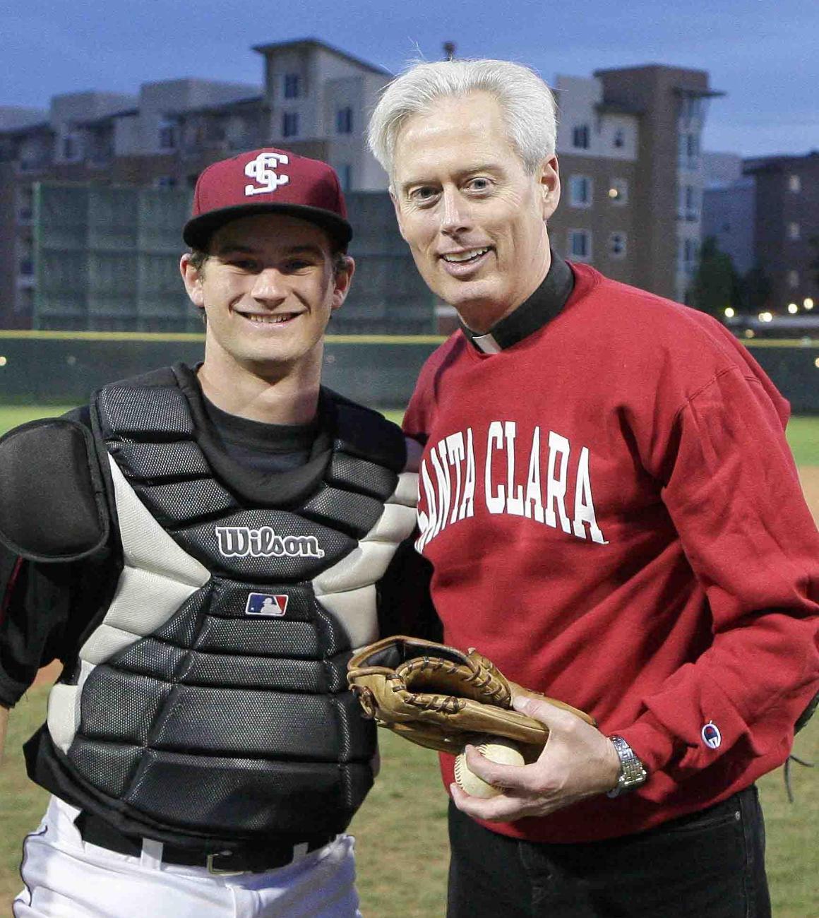 Fr. Jack Treacy with student baseball player