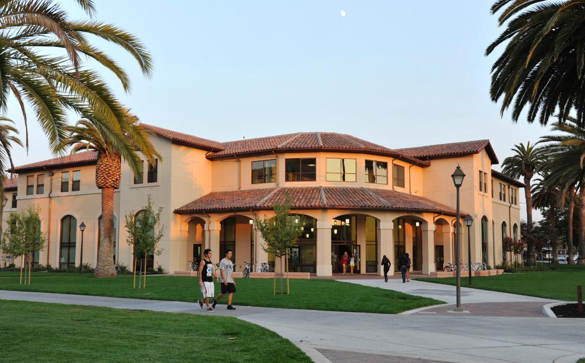 Student walking past Graham Hall.