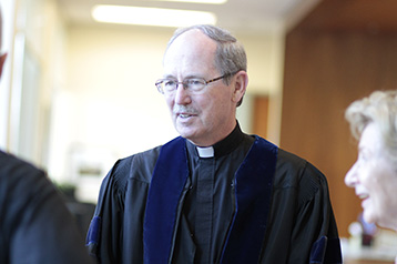 Fr Engh speaks with event guests 