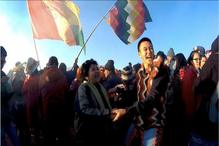 Student celebrating with a woman at a festival 