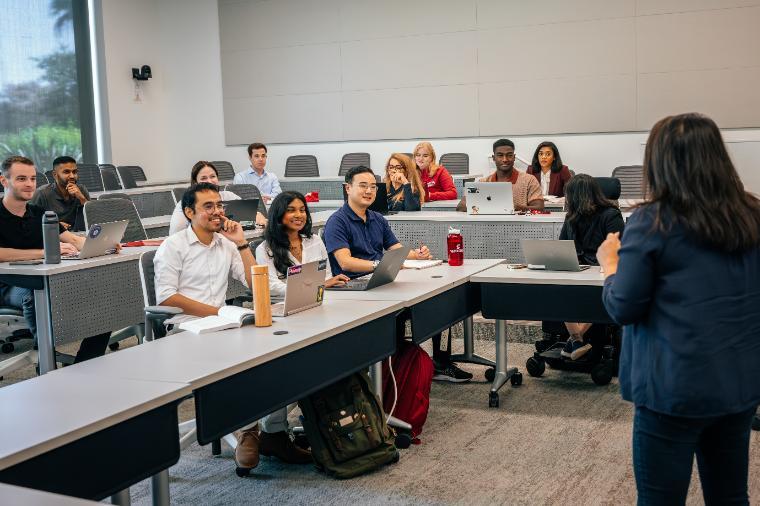 several students sitting at conference table
