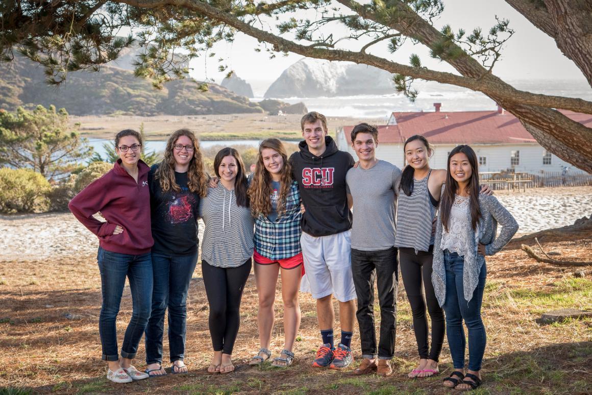 A group of people posing outdoors in the Class of 2018 photo. image link to story